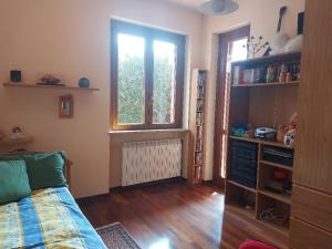 a living room with a couch and a window at Appartamento intero in casa indipendente in Biella