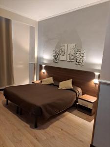 Postel nebo postele na pokoji v ubytování Hotel Leone