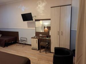 TV a/nebo společenská místnost v ubytování Hotel Leone