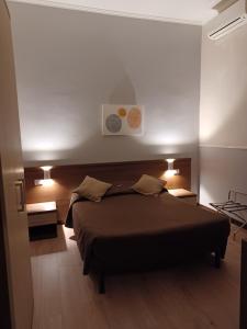 Postel nebo postele na pokoji v ubytování Hotel Leone