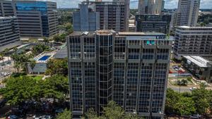 an aerial view of a tall building in a city at Like U Hotel Brasília in Brasilia
