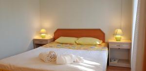 Postel nebo postele na pokoji v ubytování Boncuklu Otel