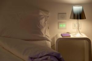 Postel nebo postele na pokoji v ubytování 8Piuhotel