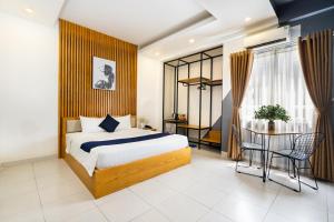 Ένα ή περισσότερα κρεβάτια σε δωμάτιο στο Joi Hospitality - Hoang Anh