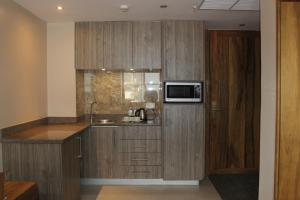 Kuchyň nebo kuchyňský kout v ubytování Arcadia Suites - Kampala