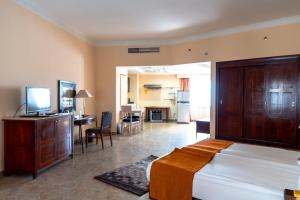 A kitchen or kitchenette at Swiss Inn Plaza Hotel