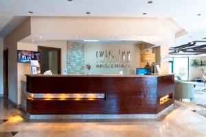 The lobby or reception area at Swiss Inn Plaza Hotel