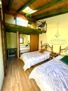 Postel nebo postele na pokoji v ubytování Casa Rural Juan de Austria