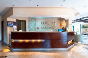 The lobby or reception area at Swiss Inn Plaza Hotel