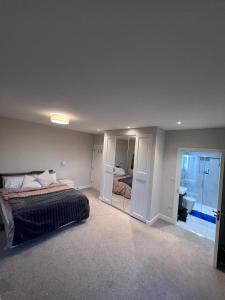 a bedroom with a bed and a large mirror at Deluxe central London in London