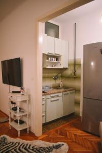 Nina Apartment tesisinde mutfak veya mini mutfak