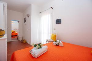 Giường trong phòng chung tại Villino Le Luccine bilo