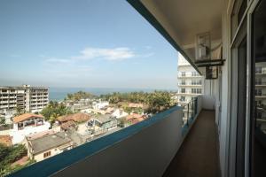 a balcony with a view of the ocean at BNB RESIDENCIES MOUNT LAVINIA in Mount Lavinia
