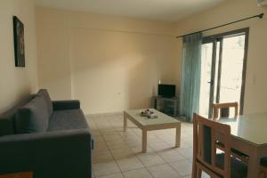 TV a/nebo společenská místnost v ubytování Baia Blu Apartments