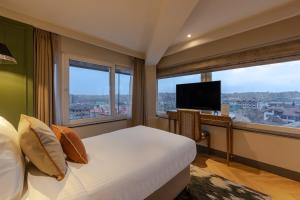 TV a/nebo společenská místnost v ubytování Sarovar Portico Srinagar