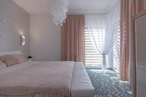 Posteľ alebo postele v izbe v ubytovaní Apartament & Spa 5 Mórz + 35 fotografií