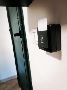 a box on a wall next to a door at HOLLY CASA VACANZE TORRE DELL'ORSO in Torre dell'Orso