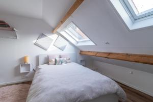 Posteľ alebo postele v izbe v ubytovaní De fil en Aiguille - Duplex pour 4 à Calais