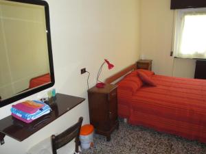 Postel nebo postele na pokoji v ubytování La Piazza B&B