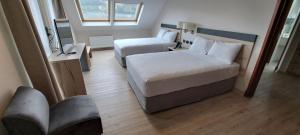 Postel nebo postele na pokoji v ubytování Hotel Diego de Almagro Castro