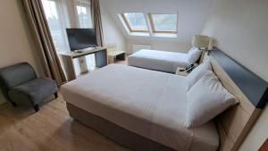 Postel nebo postele na pokoji v ubytování Hotel Diego de Almagro Castro