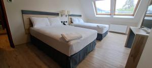 Postel nebo postele na pokoji v ubytování Hotel Diego de Almagro Castro