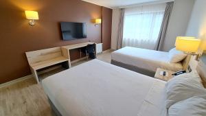 Postel nebo postele na pokoji v ubytování Hotel Diego de Almagro Castro