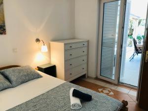 Кровать или кровати в номере Green Paradise Apartment Novalja