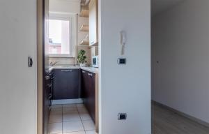 a small kitchen with a sink and a stove at Casa Martina in Castelletto sopra Ticino