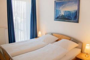 מיטה או מיטות בחדר ב-KD16-69 - Ferienwohnung Standard