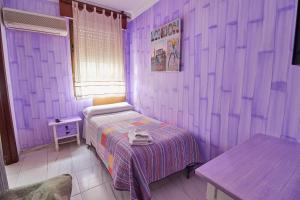 Postel nebo postele na pokoji v ubytování Hotel Virgen de los Reyes