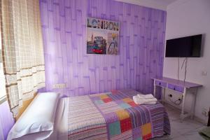 Postel nebo postele na pokoji v ubytování Hotel Virgen de los Reyes