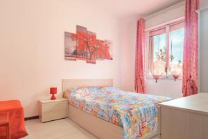 Ένα ή περισσότερα κρεβάτια σε δωμάτιο στο RivieraRent Appartamento Cristina