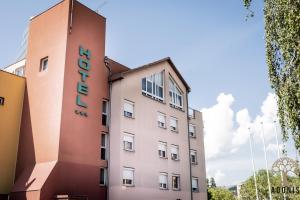 a pink building with the word hotel on it at Adonis Gapotel in Gap