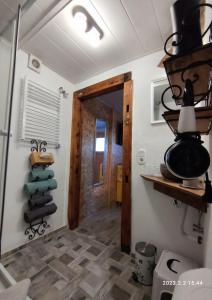 a room with a hallway with a door and some towels at Ferienwohnung Schug in Homburg