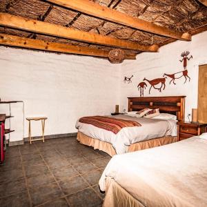 Postel nebo postele na pokoji v ubytování Incahuasi Travelodge