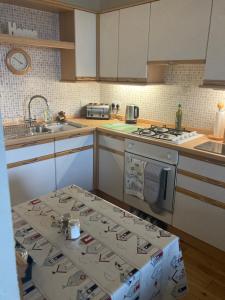 a kitchen with a box in the middle of it at The Lighthouse Loft in Whitehead