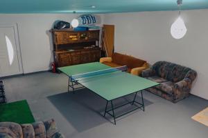 a living room with a table and a couch at Apartment Benjo in Sarajevo