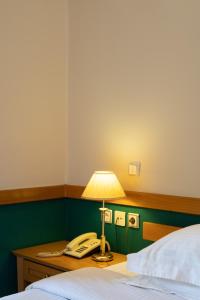 A bed or beds in a room at Hotel Ntinas