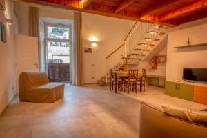 a large living room with a table and chairs at La Dimora di Nonna Maria in Maiori