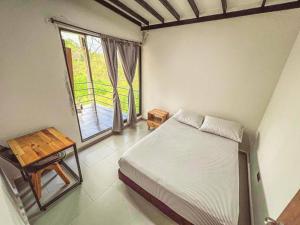 Cama o camas de una habitación en Casa de Campo en Ibagué, vía San Bernardo