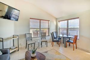 a living room with a table and chairs at Hot Springs Natl Park Condo with Water Views! in Lake Hamilton