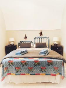 A bed or beds in a room at Masseria I Raffi b&b