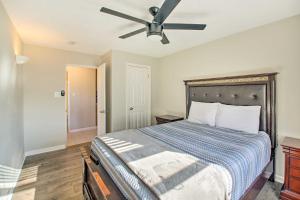 a bedroom with a bed with a ceiling fan at Hot Springs Natl Park Condo with Water Views! in Lake Hamilton +25 photos