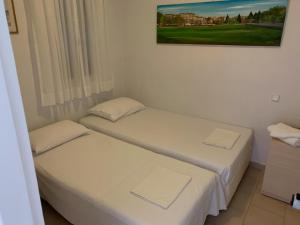 Postel nebo postele na pokoji v ubytování Tereza House