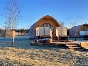 a large dome shaped building with a stove in a field at Finest Retreats - Mingle Dale in York