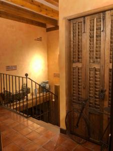 a bike parked next to a door in a room at Apartamentos Lobiche in Navafría