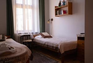 Posteľ alebo postele v izbe v ubytovaní Kolory Guest House