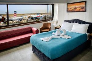 Postel nebo postele na pokoji v ubytování Elite Holiday Hotel