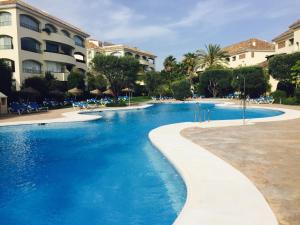 a swimming pool with blue water in a resort at Vista Hermosa Marbella in Marbella